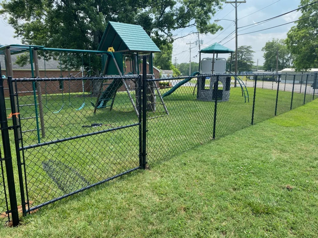 Black chain link fence with a gate installed by CC Fencing in Upstate SC