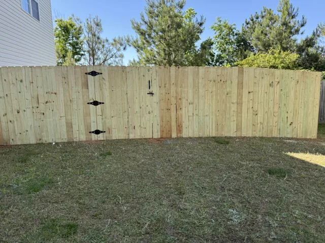 Wood privacy fence with gate, installed by CC Fencing